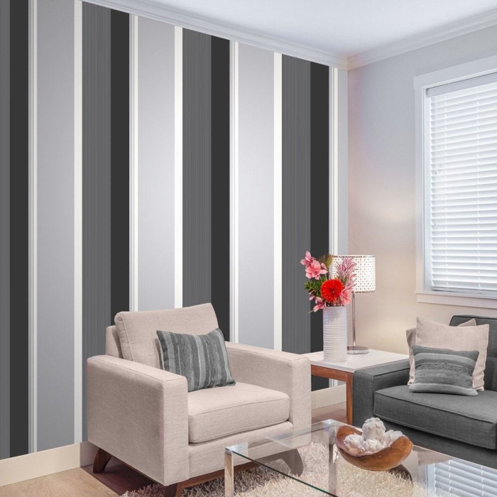 grey to black multi striped wallpaper on wall in living room