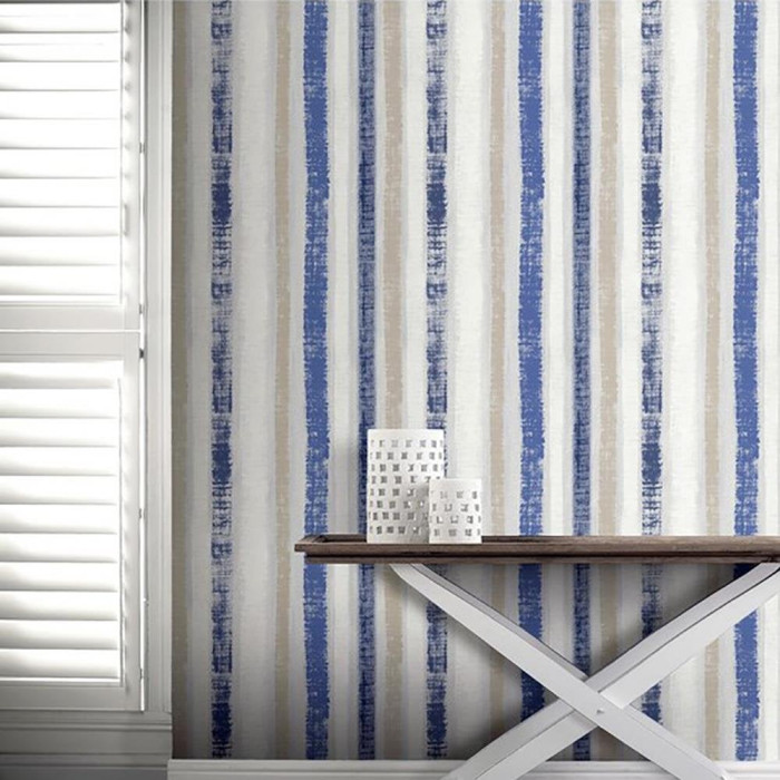  blue and yellow painted stripe wallpaper in a hallway 